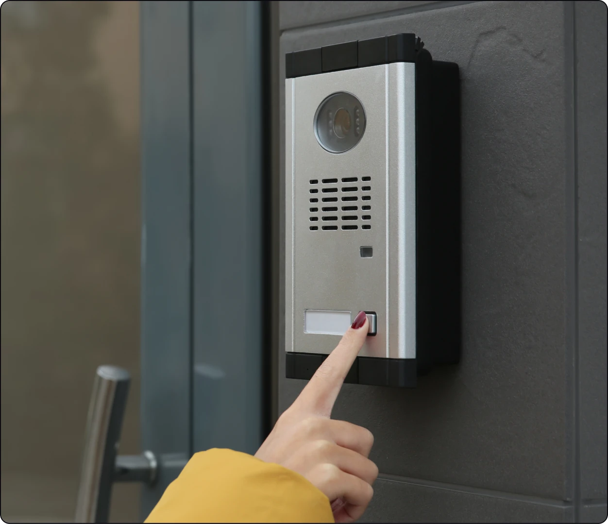 Hand pressing modern doorbell